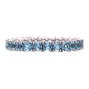 Blue topaz eternity band