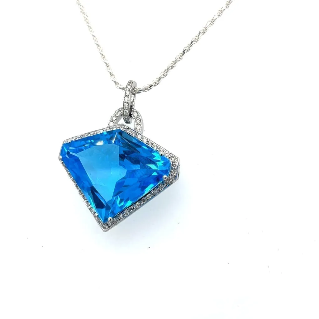 Shield Cut Blue Topaz Set in a 14k White Gold Pendant with Accent Diamonds at Regard Jewelry in
