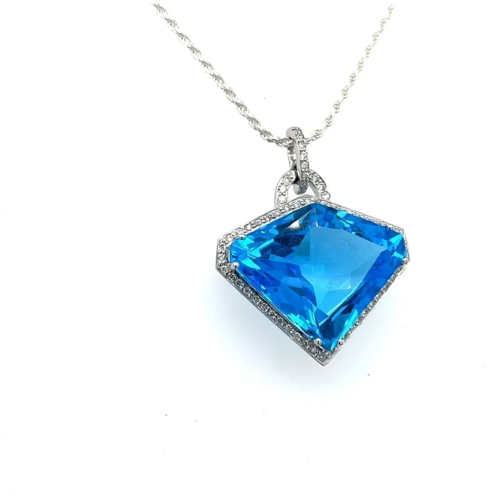 Shield Cut Blue Topaz Set in a 14k White Gold Pendant with Accent Diamonds at Regard Jewelry in